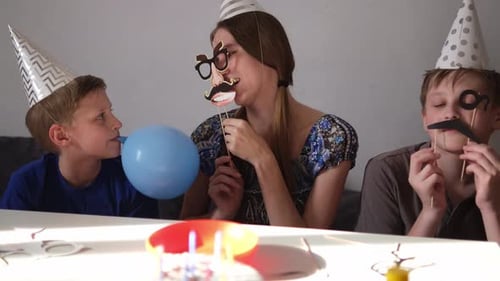 Fun Birthday Celebration with Family and Silly Props