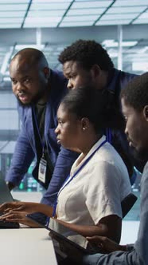 Vertical Video Team of Data Center Technicians Maintaining Company Network Infrastructure