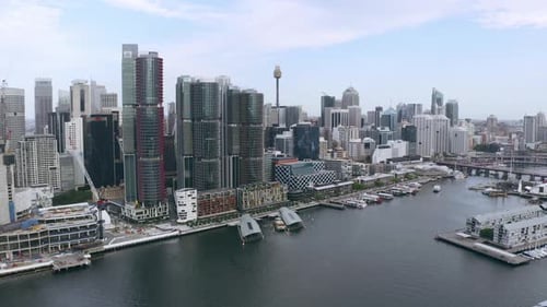 A harbour surrounded by a busy city during the day