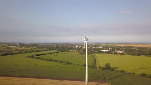 Aerial View of Wind Turbine Generators in Field Producing Clean Ecological Electricity
