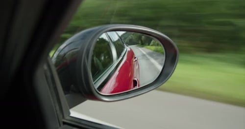 alfa romeo giulia driving looking to back mirror