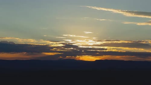 Sunset Time-lapse Over Mountain Horizon