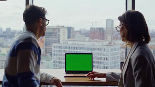 Two Teammates Looking Greenscreen Laptop Working Panoramic Hall Together Closeup
