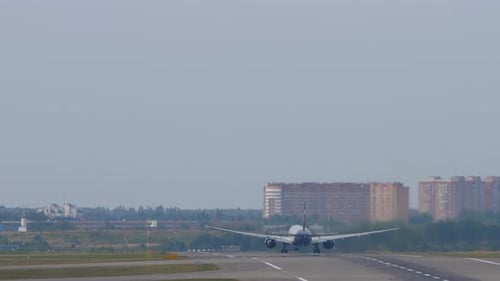 Plane Takes Off From Airport Runway During the Day