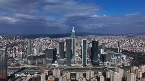 Aerial view of towering skyscrapers and the ever-changing urban landscape under shifting skies. 1
