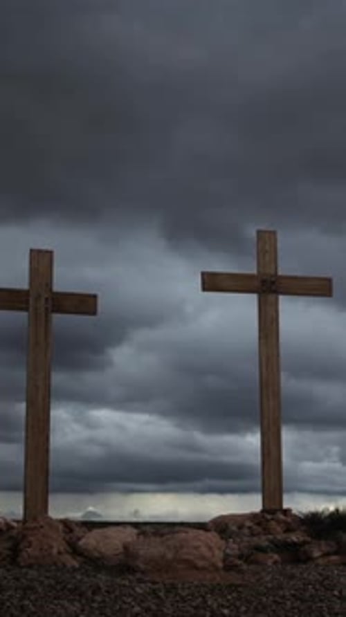 Two Wooden Crosses Under Dramatic Sky
