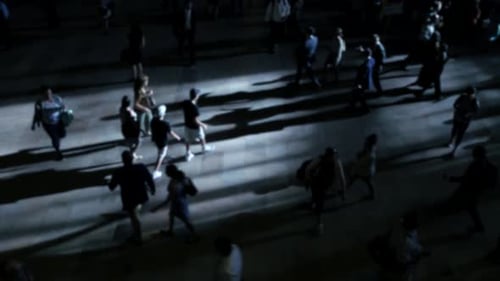 Commuters Crowd Navigating the City Streets