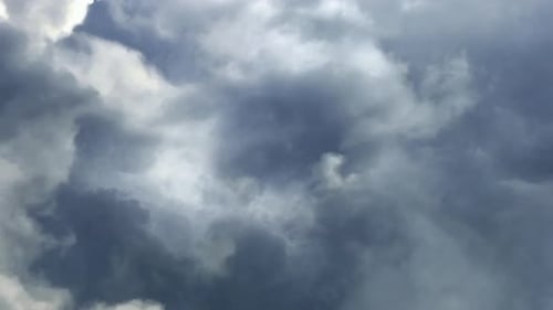 4k dark cumulonimbus clouds in the sky during thunderstorm.