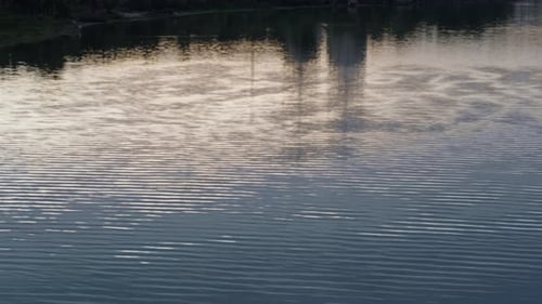 Calm River Ripples Reflecting Abstract Cityscape Drone . Blue Water Texture. Relaxing