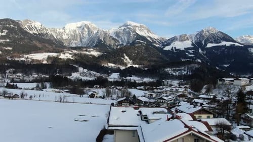 Aerial camera span towards a massive mountain range in 4k