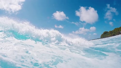 Ocean wave. Crystal clear ocean wave rolls and breaks. Indian Ocean's wave breaking on the shore