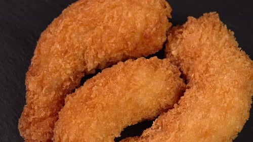 Crisp fried shrimp or coated prawn rotate macro. Footage for advertising speedy munchies