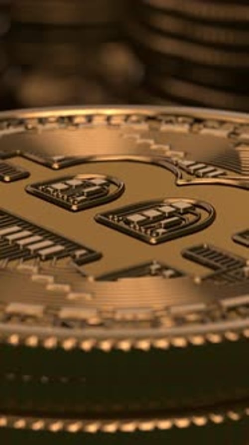 Bitcoins stacked on glossy black background