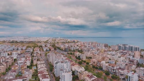 Flight Over the Resort Town on the Background of the Sea