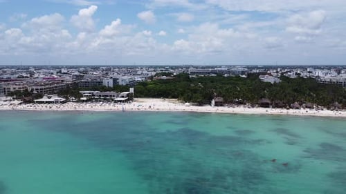 Tourists and locals relaxing on the beach. Playa Del Carmen, Mexico