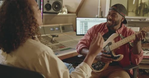 Producer and Singer Composing in Recording Music Studio