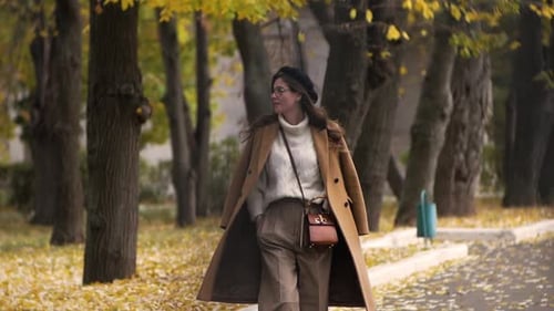 Young Beautiful Woman Walks Around the Autumn City Close Up Woman Portrait