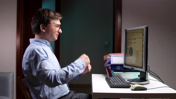Upset Man in Office Hits Slamming Keyboard with Hand and Expressing ...