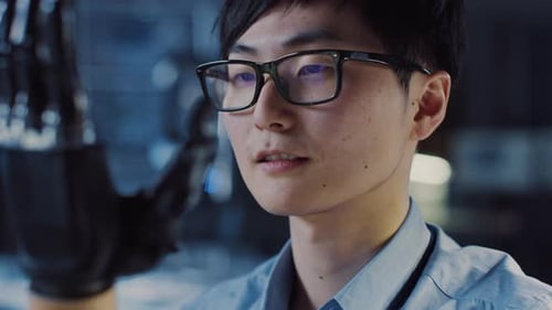 Close Up of a Futuristic Prosthetic Robot Arm Being Tested by a Professional Japanese Development E