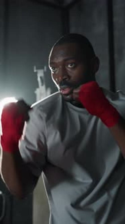 Portrait of Motivated Box Fighter in Gym Black Man Training Alone in Fight Club Motivated Sportsman