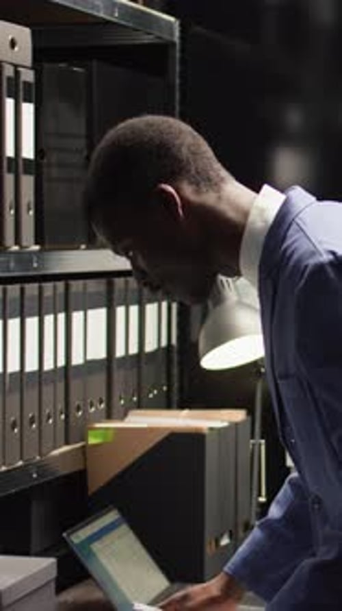Man Working Late at Computer in Dark Office