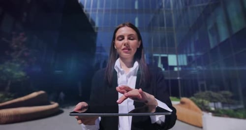 Woman Interacts With Hologram Display Using Tablet