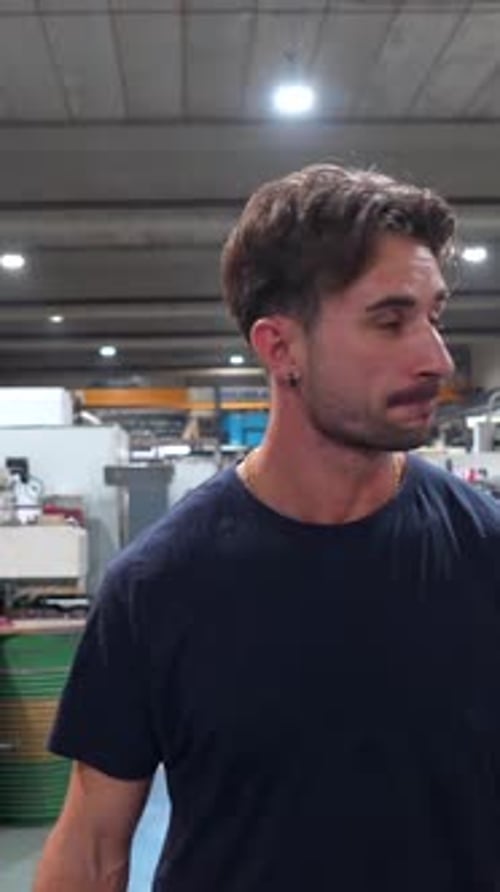 Portrait of a Young Manual Worker in a Cnc Factory