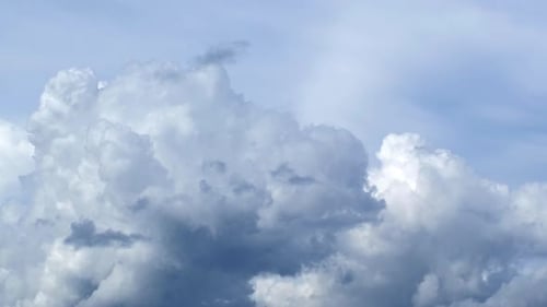 Blue sky with fluffy cloud time lapse on a sunny day 4k footage.