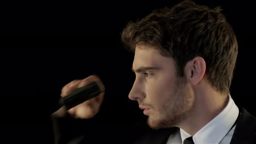 Man in Suit Looking Through Binoculars Close Up