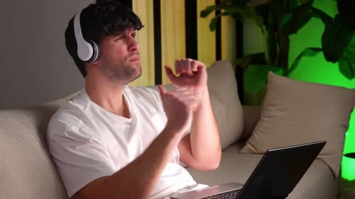 Man Sings Energetically While Listening to Music