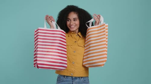 Portrait of a Woman with Colorful Bags After Successful Shopping in the Mall