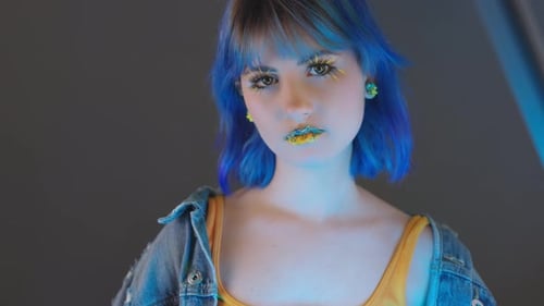 Stylish Woman with Blue Hair and Eye Makeup