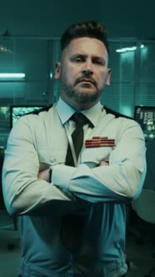 Vertical Portrait of Serious Male Army Lieutenant at Operations Center