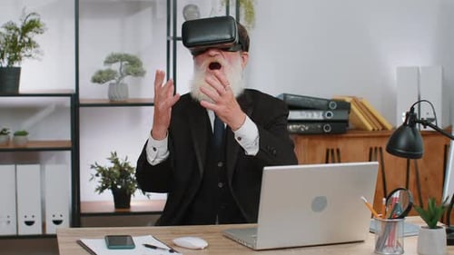 Senior Business Man in VR Goggles Watch Virtual Reality Video Working on Simulation Game at Office