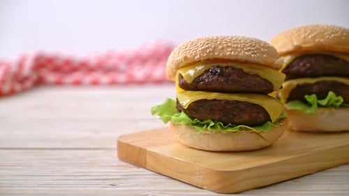 Delicious Double Cheeseburgers on a Wooden Cutting Board