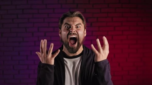 Aggressive Bearded Man Shouting and Gesturing in Studio