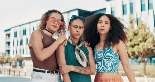 Fashion, attitude and face of women in city on weekend in trendy clothes