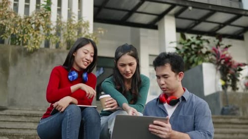 Student friend sit and talk about learning content subject in classroom in university or high school