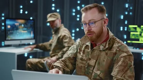 Military Men Working on Computers in Tech Room