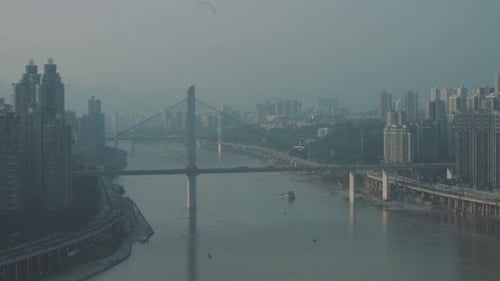 A cruise ship is running under the bridge