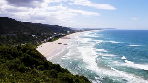 Scenic Wilderness beach with rolling waves - panoramic aerial view, Garden Route