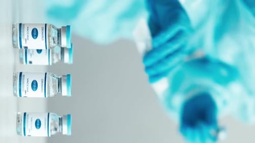 Healthcare Worker Prepares Covid-19 Vaccine in Lab