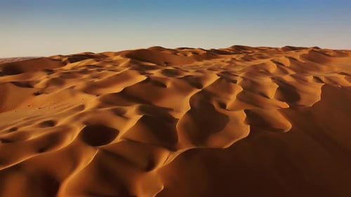 Sand dunes in Arabian desert aerial view. Liwa, Abu Dhabi, United Arab Emirates