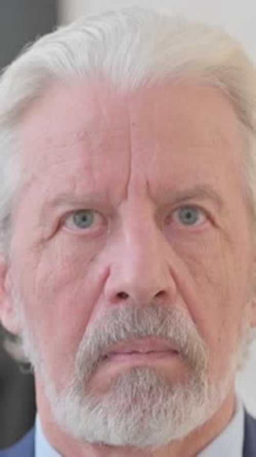 Close up of Serious Old Man Face, vertical video