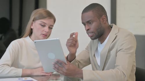 Multi Ethnic Business People Working on Tablet in Office