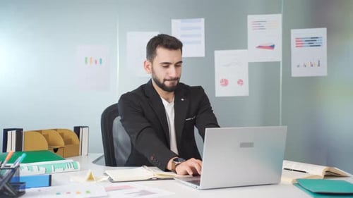 Young entrepreneur works in his office.