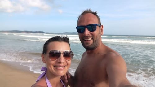 Young, Happy Couple Recording Video, Taking Selfie on Beach, Super