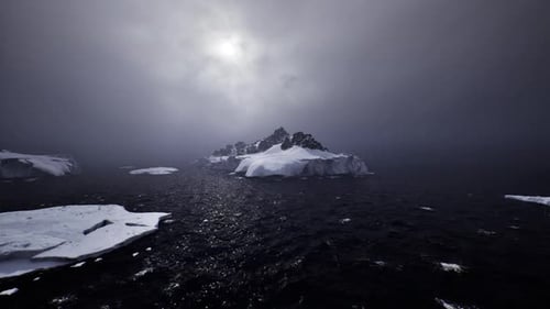Dramatic Arctic Ocean with Ice Floes and Mountains