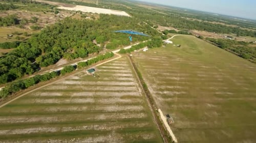 Drone shot - Hang glider flies past as we turn to follow