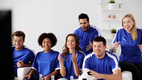 Friends Watching a Soccer Game at Home, Cheering